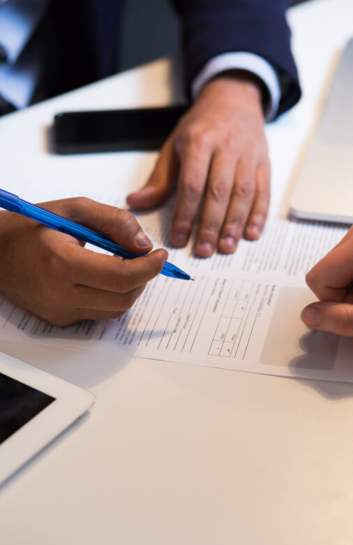 Close-up Of An African Businessperson Signing Contract